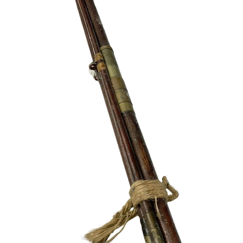 764 - A large Victorian fishing rod.