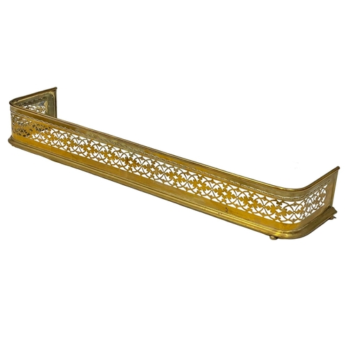 780 - A late Georgian pierced brass fender.  139x31cm