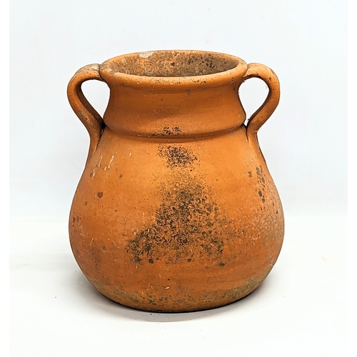 260E - A terracotta 2 handled pot.