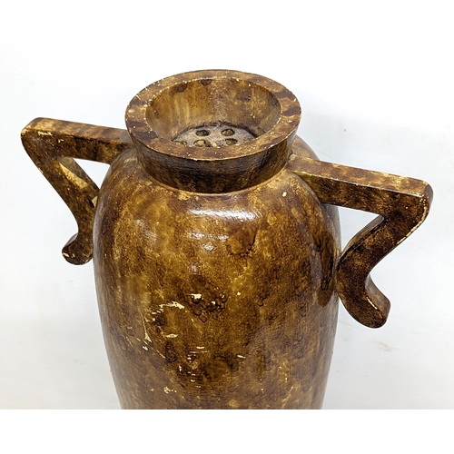 780X - A large early 20th century wooden vase. 70cm