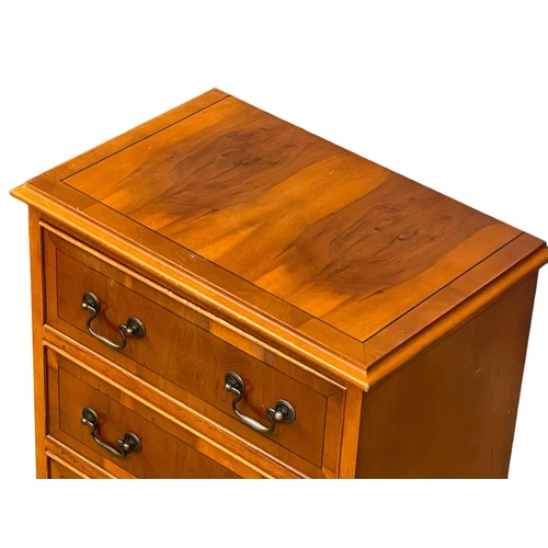 1106 - A small Georgian style yew wood chest of drawers. 49x32x64cm