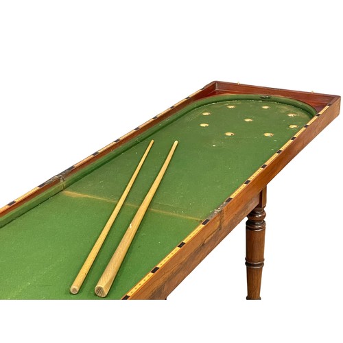 1094 - A Victorian mahogany Bagatelle table.