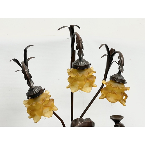 669E - A large Cavalier table lamp with Amber glass shades. 107cm