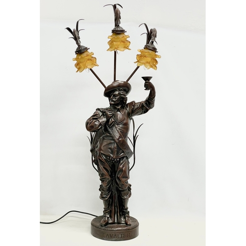 669E - A large Cavalier table lamp with Amber glass shades. 107cm