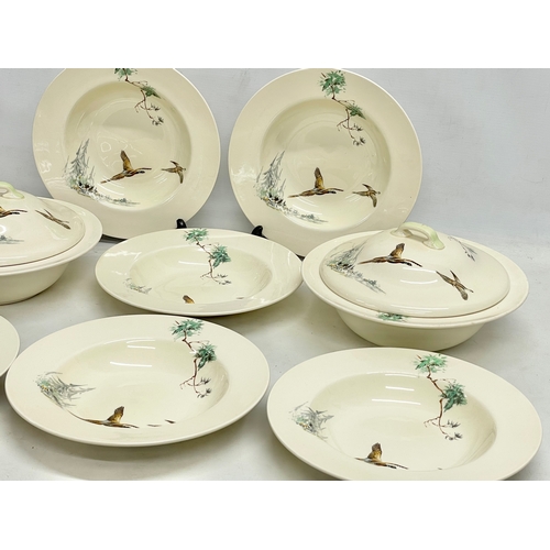 797 - A Royal Doulton ‘Cappice’ part dinner set. A pair of tureens and 6 soup bowls.
