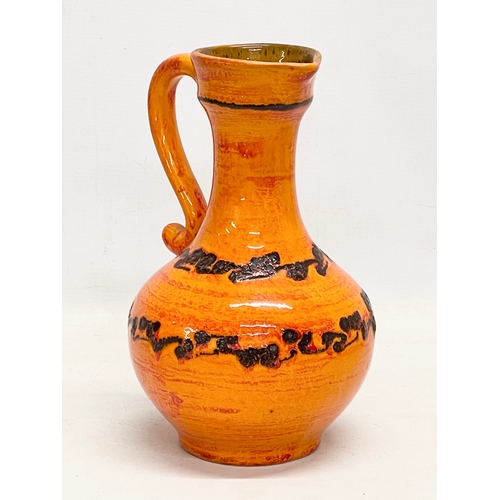 1 - A Mid Century West German glazed pottery jug. 26cm