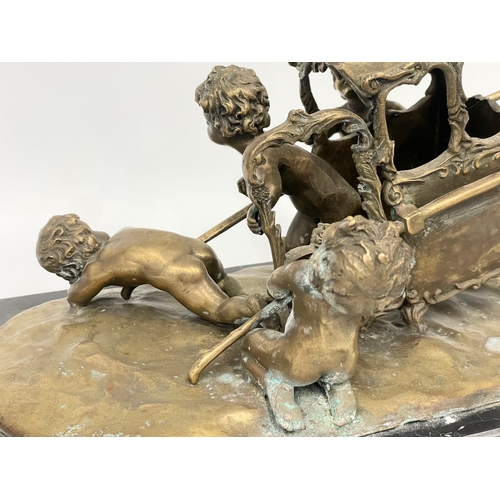 2 - A large early 20th century ornate brass French Putti and carriage figure on marble base. In the mann... 