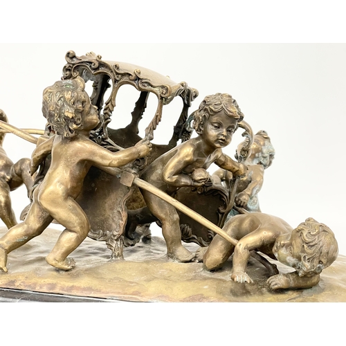 2 - A large early 20th century ornate brass French Putti and carriage figure on marble base. In the mann... 