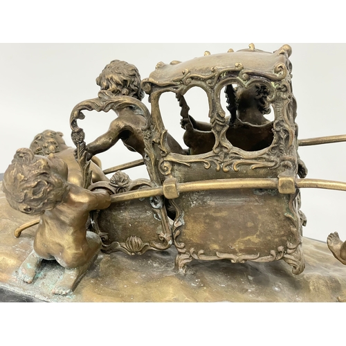 2 - A large early 20th century ornate brass French Putti and carriage figure on marble base. In the mann... 