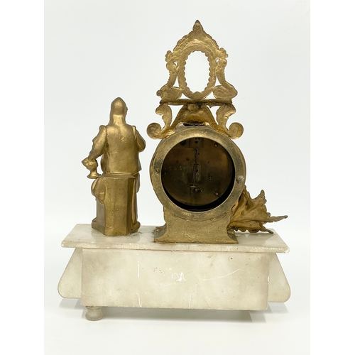 5 - A late 19th century French brass and onyx clock set. Clock measures 25x10x31cm. Candelabras 38.5cm.