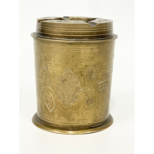 9 - A vintage brass tobacco jar and ashtray. 10cm