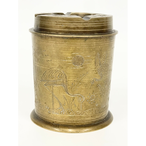 9 - A vintage brass tobacco jar and ashtray. 10cm