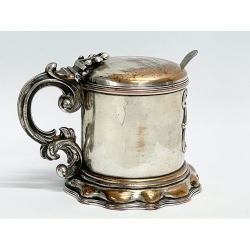 14 - A 19th century ornate silver plated mustard pot with original Bristol Blue liner. 10x8x7cm