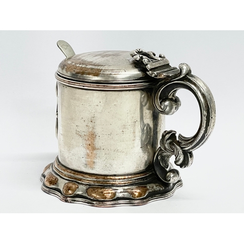 14 - A 19th century ornate silver plated mustard pot with original Bristol Blue liner. 10x8x7cm