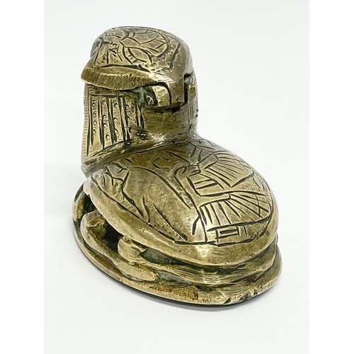 35 - A Victorian brass Egyptian Revival inkwell. 7.5x5cm