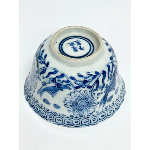 38 - A 19th century Chinese porcelain tea bowl and saucer. Kangxi mark.