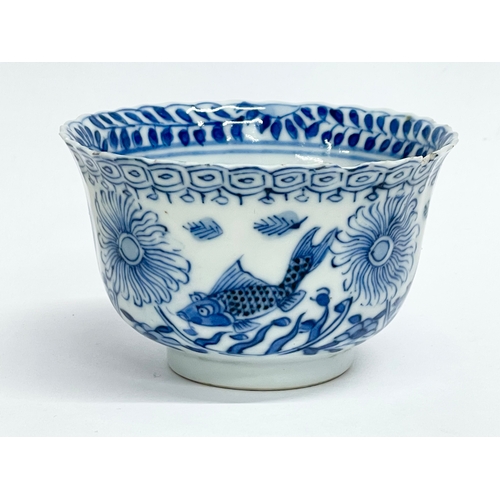 38 - A 19th century Chinese porcelain tea bowl and saucer. Kangxi mark.