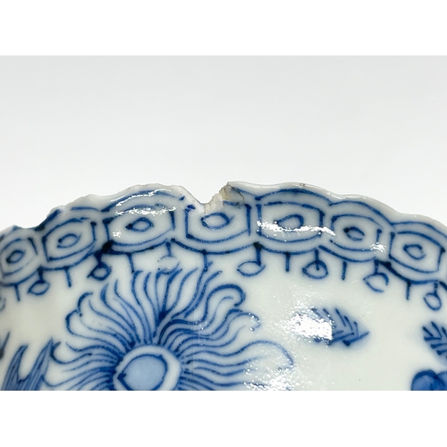 38 - A 19th century Chinese porcelain tea bowl and saucer. Kangxi mark.