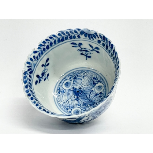 38 - A 19th century Chinese porcelain tea bowl and saucer. Kangxi mark.