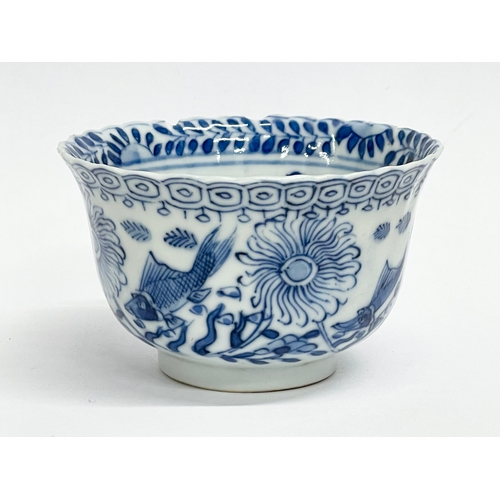 38 - A 19th century Chinese porcelain tea bowl and saucer. Kangxi mark.