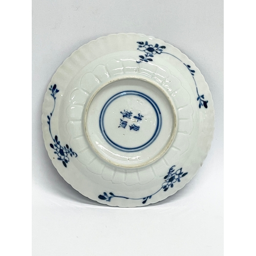 38 - A 19th century Chinese porcelain tea bowl and saucer. Kangxi mark.