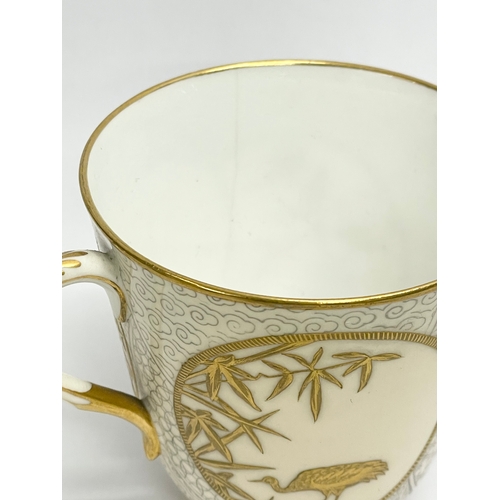 39 - A rare late 19th century Royal Worcester gilt porcelain cup and saucer. Decorated with spiders, cran... 