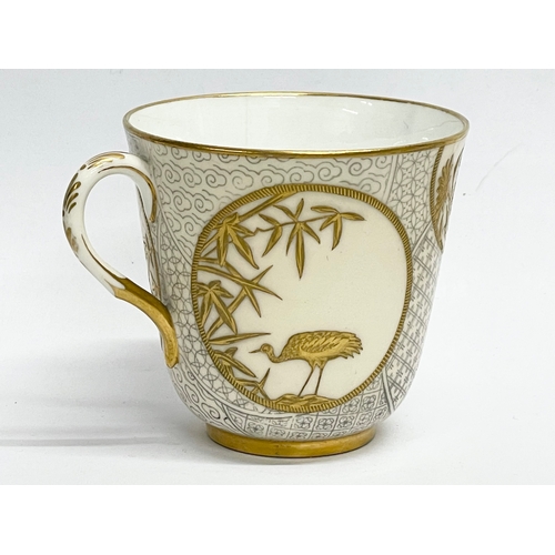 39 - A rare late 19th century Royal Worcester gilt porcelain cup and saucer. Decorated with spiders, cran... 