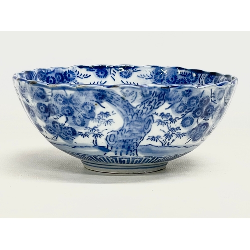 41 - A 19th century Japanese blue and white porcelain bowl on stand. Bowl measures 16x6.5cm