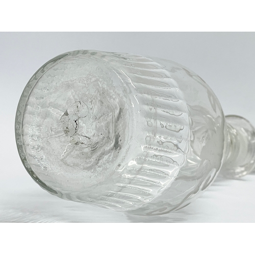 23 - An Irish Regency period small etched crystal decanters and stopper. Circa 1800-1810. 21cm