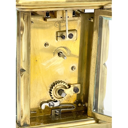 19 - An early 20th century French brass carriage clock. Circa 1900. 8x6x15cm including handle.