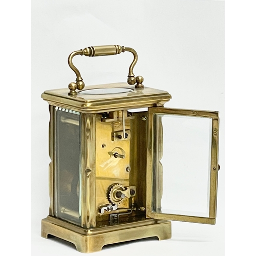 19 - An early 20th century French brass carriage clock. Circa 1900. 8x6x15cm including handle.