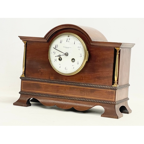 46 - A late Edwardian inlaid mahogany mantle clock with brass mounts, key and pendulum. Riddles Limited, ... 