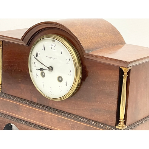 46 - A late Edwardian inlaid mahogany mantle clock with brass mounts, key and pendulum. Riddles Limited, ... 