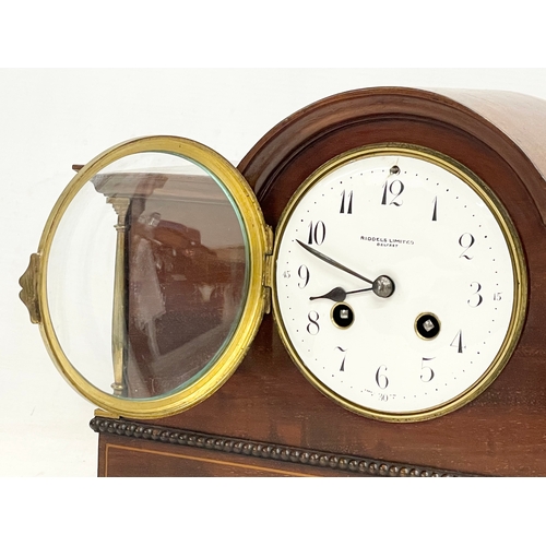 46 - A late Edwardian inlaid mahogany mantle clock with brass mounts, key and pendulum. Riddles Limited, ... 