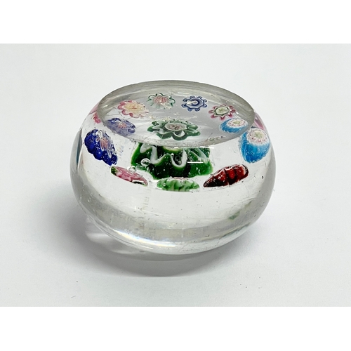 29 - A 19th century Clichy Millefiori miniature paperweight. Circa 1840-1860. 4.5x3cm