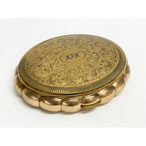 75 - 3 vintage compacts. A Kigu brass and enamel compact. A Kigu Minuette musical compact.