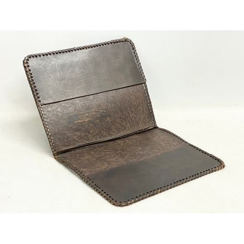 76 - 3 vintage embossed leather cases. A Gaelic leather folder 18x22.5cm. A leather card case and a leath... 