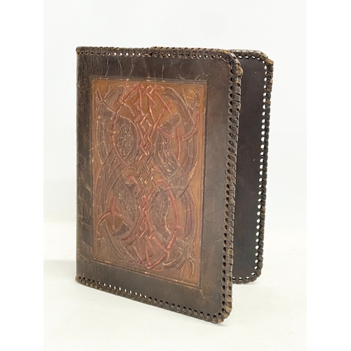 76 - 3 vintage embossed leather cases. A Gaelic leather folder 18x22.5cm. A leather card case and a leath... 