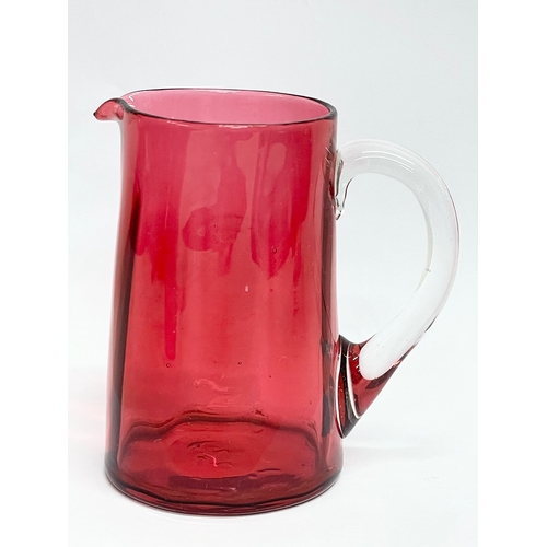 58 - A collection of Victorian Cranberry and Ruby Glass. Largest Ruby Glass jug measures 18x18cm. A pair ... 