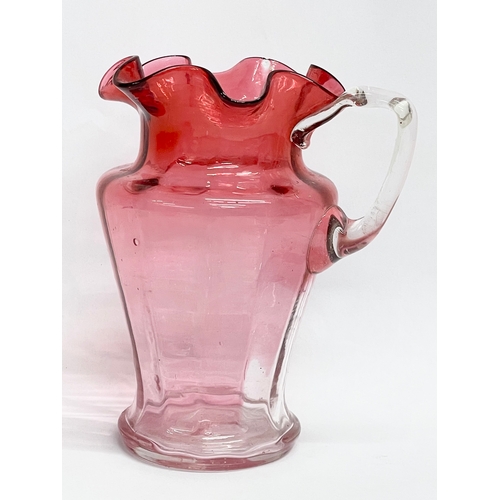 58 - A collection of Victorian Cranberry and Ruby Glass. Largest Ruby Glass jug measures 18x18cm. A pair ... 