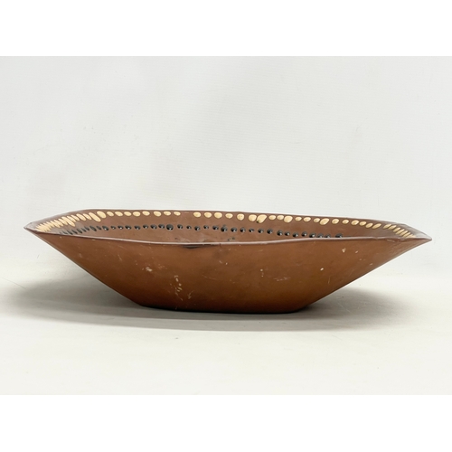 88 - A large late 19th century continental Slipware terracotta bowl. 43x43x9cm