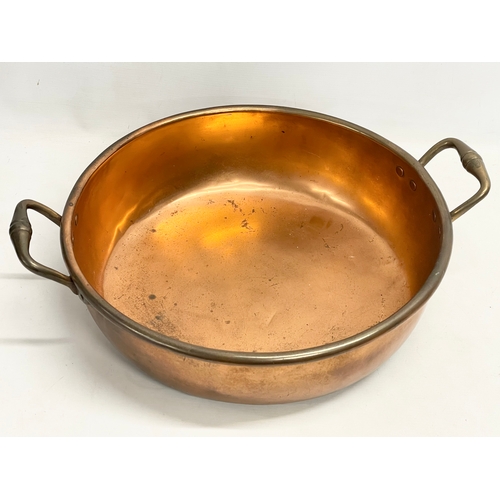 62 - A large Victorian copper 2 handled jam pan. 55x44x16cm