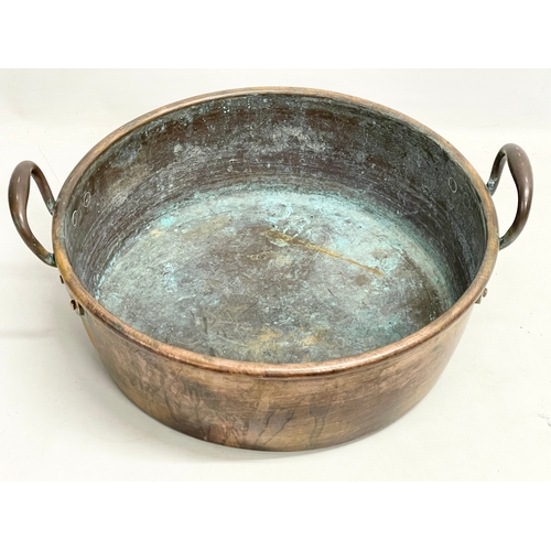 63 - A large Victorian copper 2 handled jam pan. 47x40x19cm