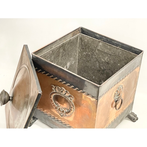 57 - A Victorian copper coal bin with liner and lion paw feet. 35x35x41cm