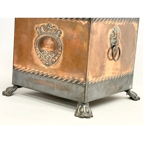 57 - A Victorian copper coal bin with liner and lion paw feet. 35x35x41cm