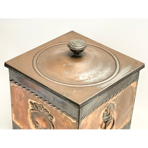 57 - A Victorian copper coal bin with liner and lion paw feet. 35x35x41cm