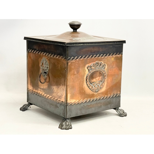 57 - A Victorian copper coal bin with liner and lion paw feet. 35x35x41cm