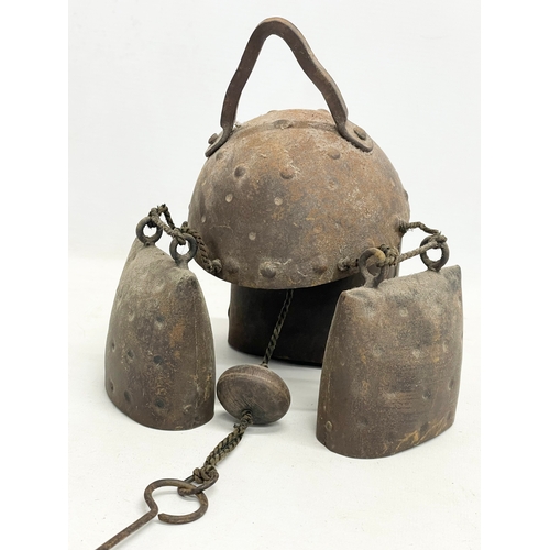 59 - A 19th century cow bell wind chime. 55cm