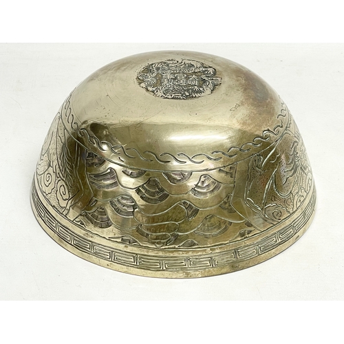 60 - A large early 20th century Chinese brass bowl on wooden stand. Bowl measures 24x11cm.