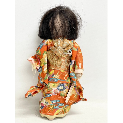 95 - An early 20th century Japanese Ichimatsu Girl doll. 28cm